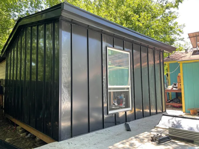 Black standing seam metal wall panels for Roof Inspection in North Springfield