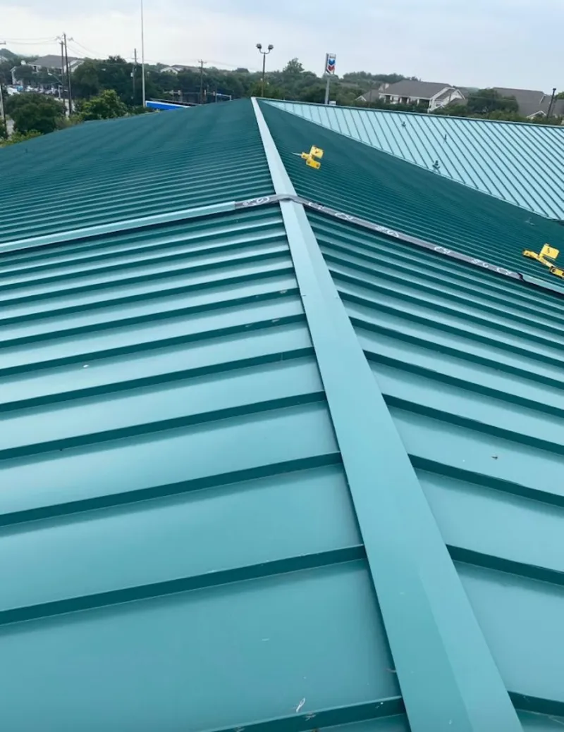 Green commercial metal roof ridge and valley for Metal Roof Repair in North Springfield