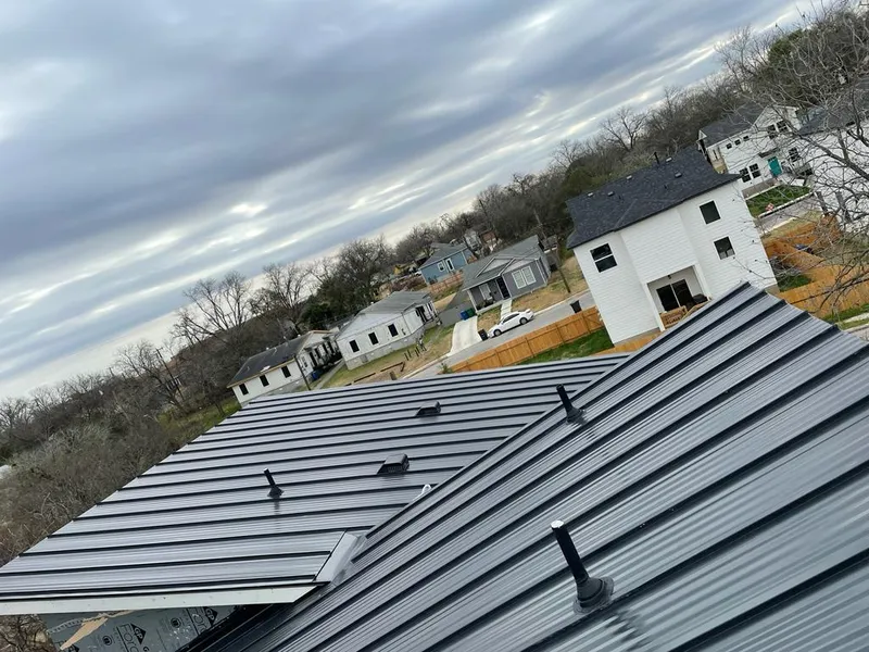 Standing seam metal roof panels with vents for Skylight Repair in North Springfield